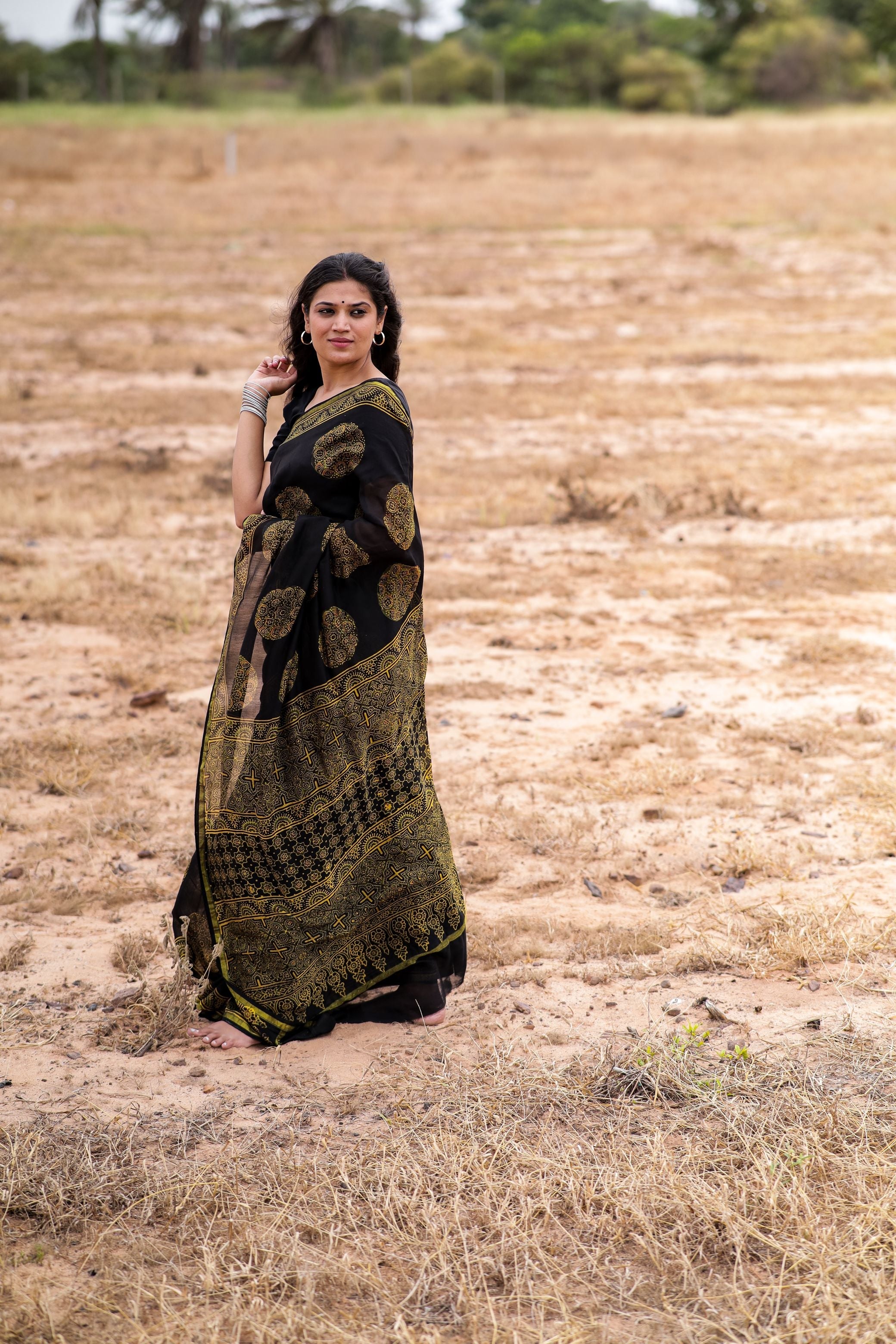 Jharokha -Black and green floral silk cotton Ajrakh handblockprinted saree