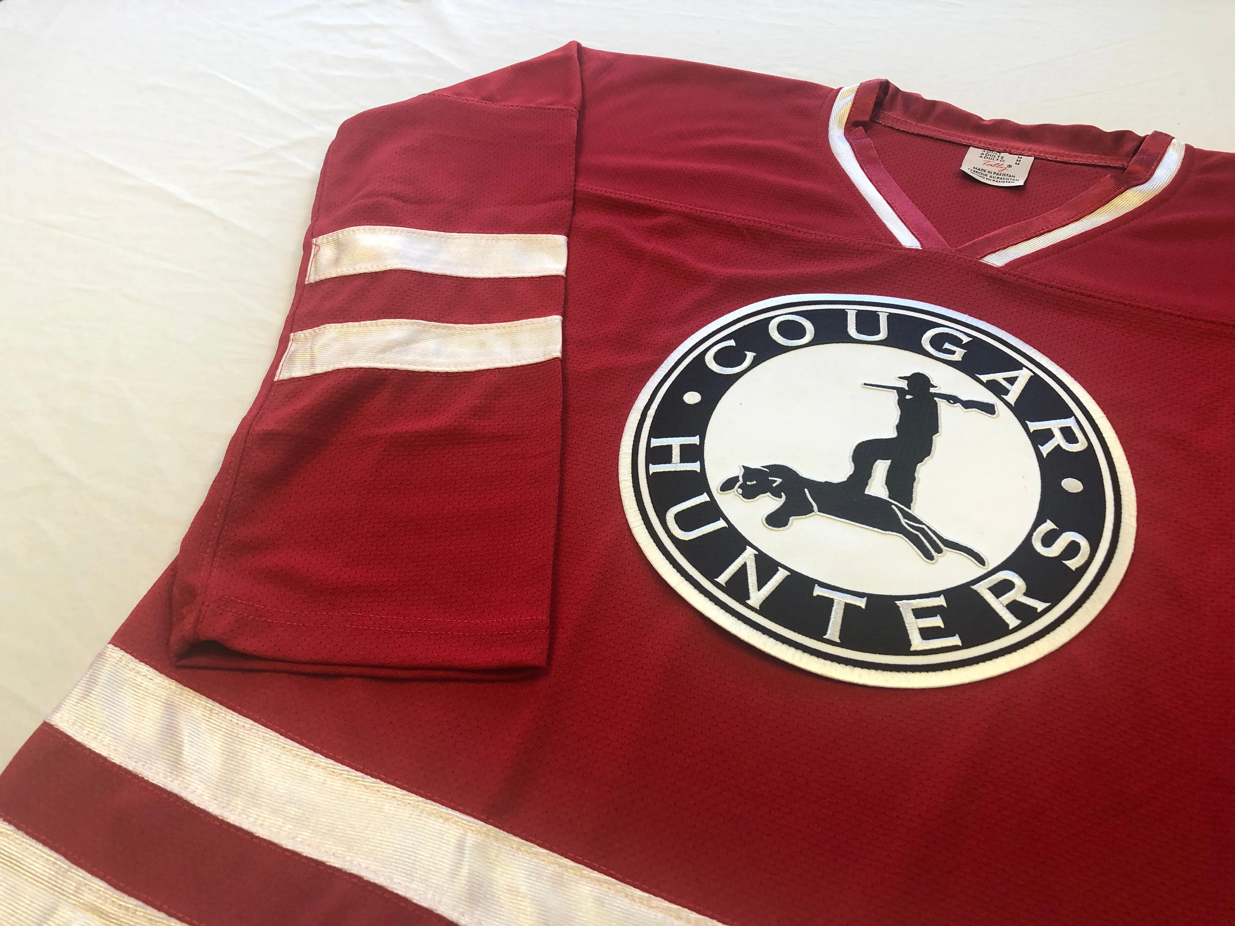 Red and White Hockey Jerseys with the Cougar Hunters Embroidered Twill Logo