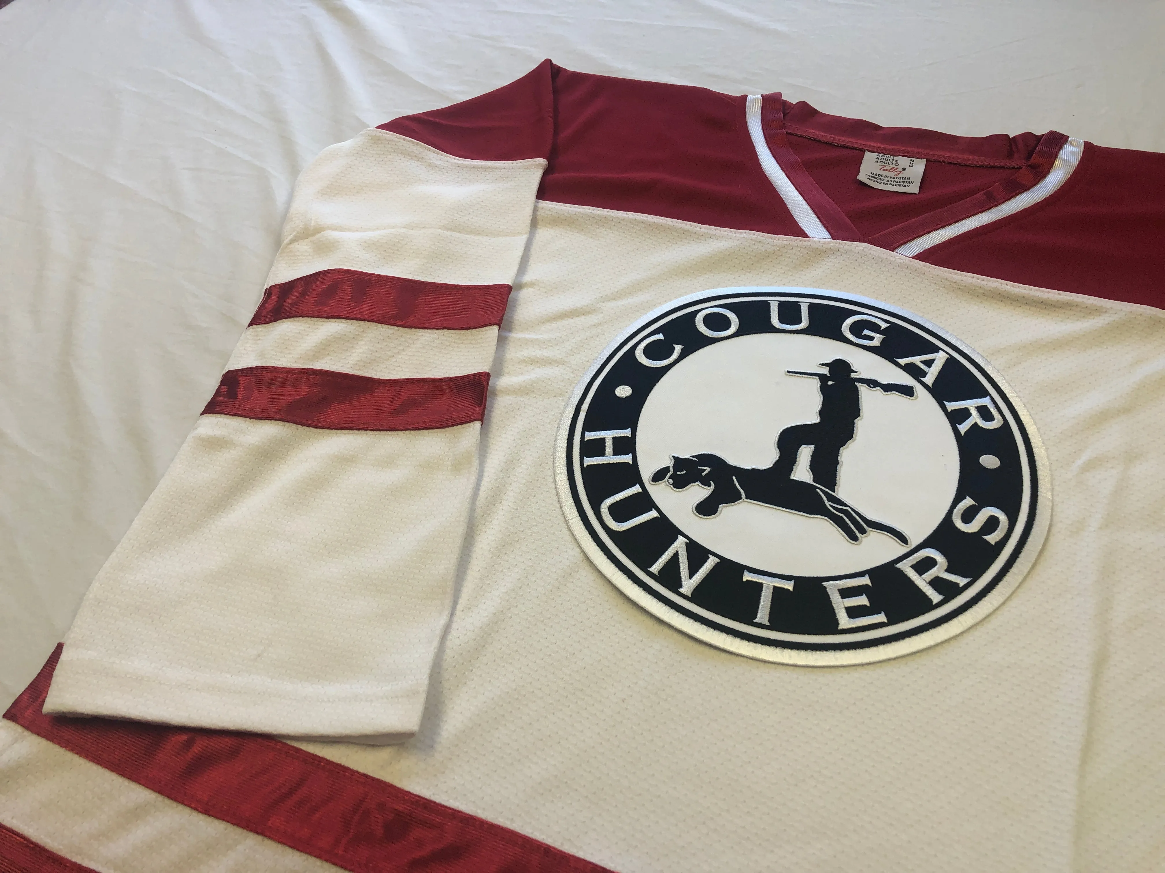 Red and White Hockey Jerseys with the Cougar Hunters Embroidered Twill Logo